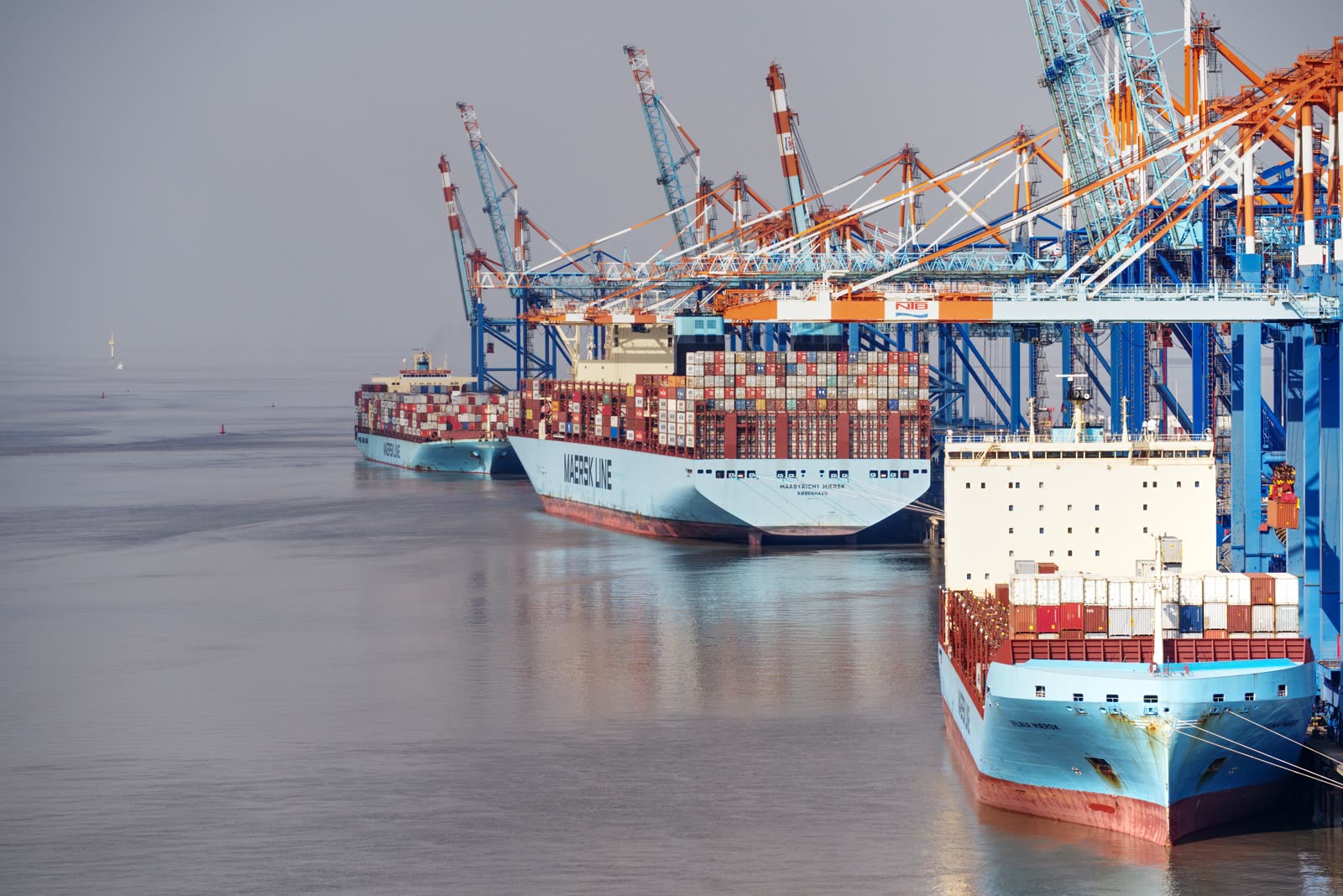 Container ships loading at a port terminal